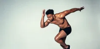 young athlete guy in running position