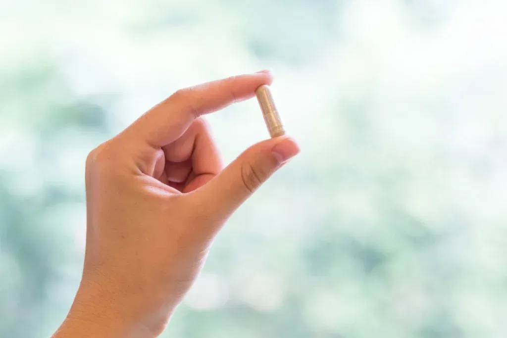 Nu-Mag supplements  held in the hand