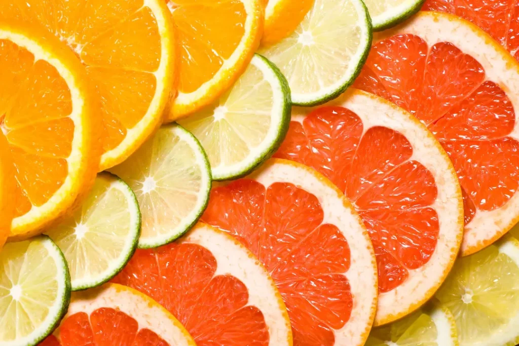 cut pieces  of  different Citrus fruits
citrus fruits Juice for immune system good