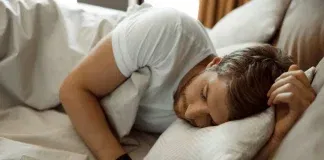 man sleeping on the bed