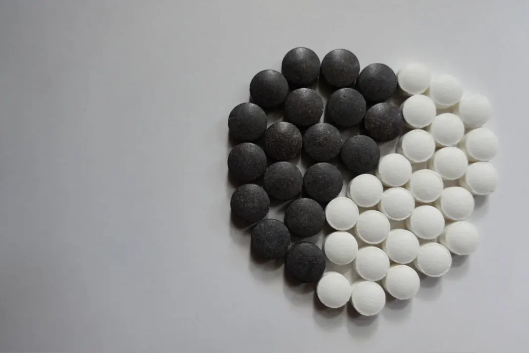 Chelated Iron pills white and black