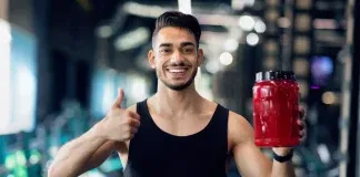 man holding protein powder