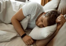 man sleeping on the bed