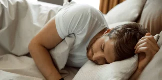 man sleeping on the bed