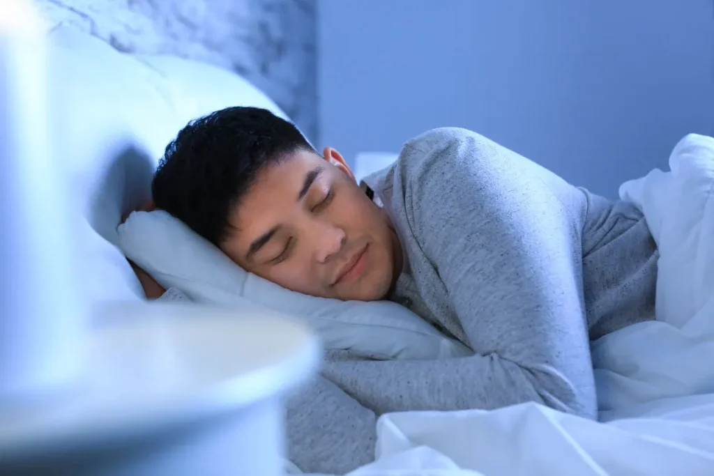 man sleeping on the bed