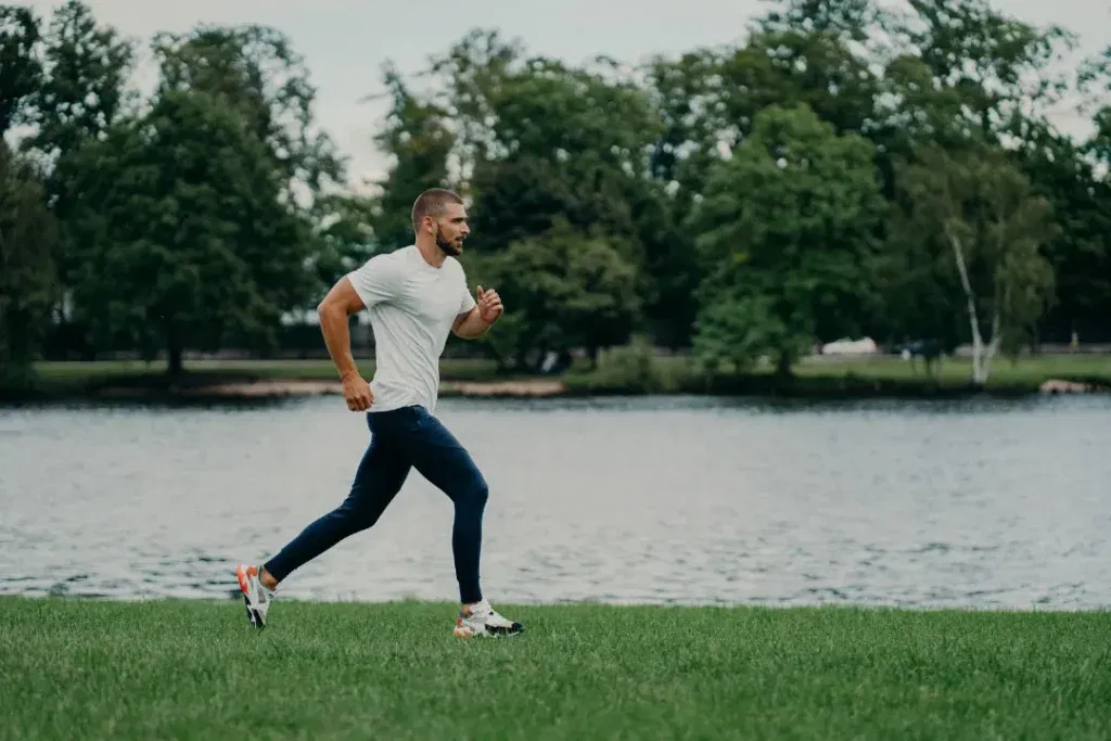 Man running in a garden. 