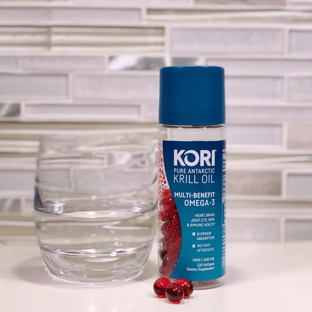 Kori krill oil 400 mg capsules along with glass of water