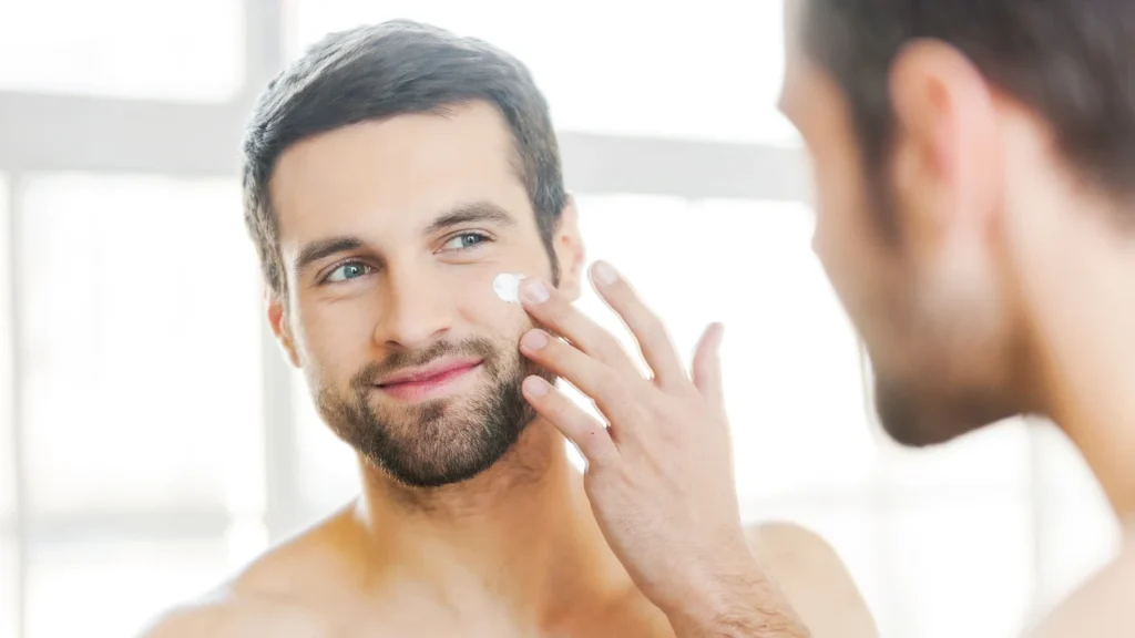 Man applying loreal men expert cream on his face