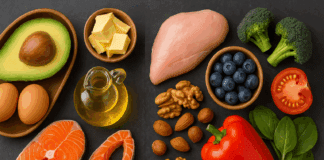 The Surprising Truth About the Keto vs Low Carb Diet Debate: What Science Really Says Split-screen comparison of keto vs low carb diet showing fatty fish, avocado, and olive oil on one side, and chicken breast, vegetables, and nuts on the other.